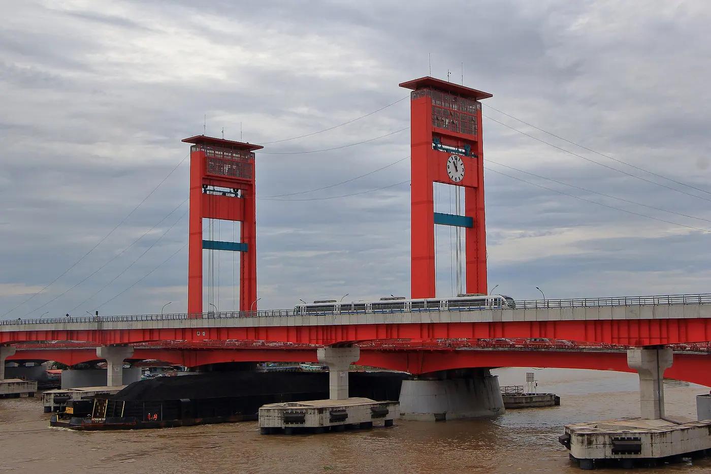 The Musi river at Palembang, South Sumatra, with the Ampera bridge behind